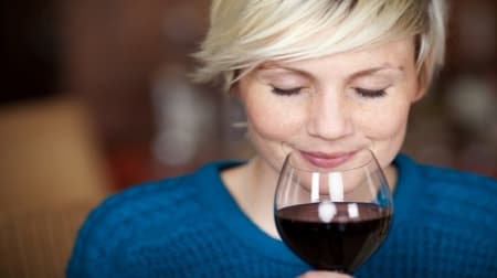 Woman tasting wine